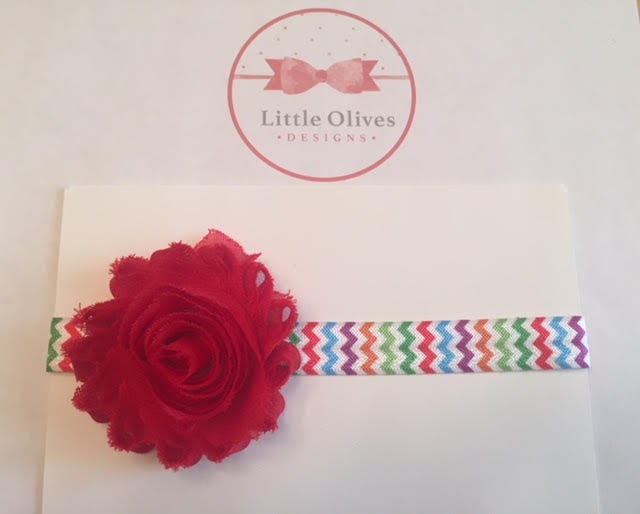 red shabby flower with rainbow chevron headband