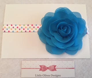 large blue chiffon rose with rainbow dots band