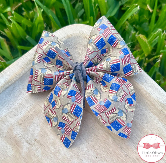 BOOTS ON THE GROUND SAILOR BOW