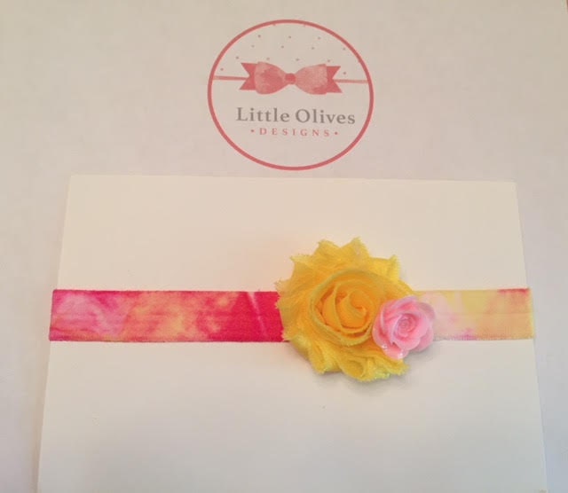 yellow and pink flowers with tie dye band