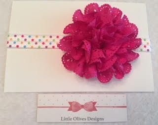 fushia eyelet flower with rainbow dots headband