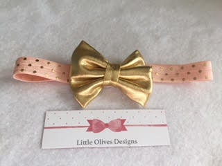 gold faux leather bow with peach and gold polka dots headband