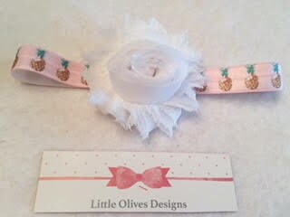 white flower with pink and brown pineapple headband