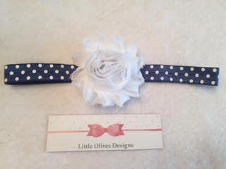 white flower with navy and white polka dots headband