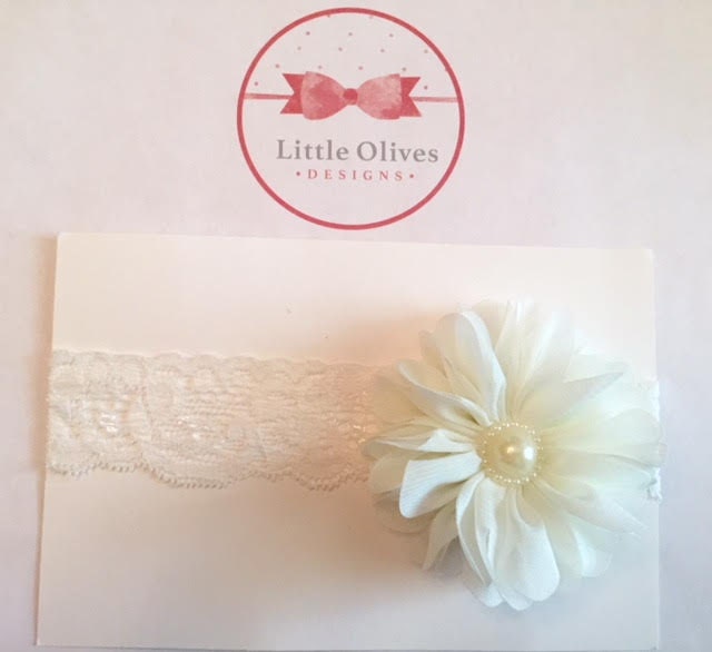 cream ballerina flower with pearl accent and cream lace band