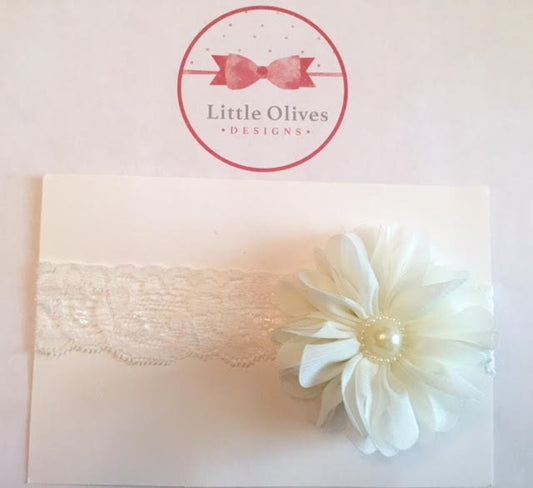 cream ballerina flower with pearl accent and cream lace band