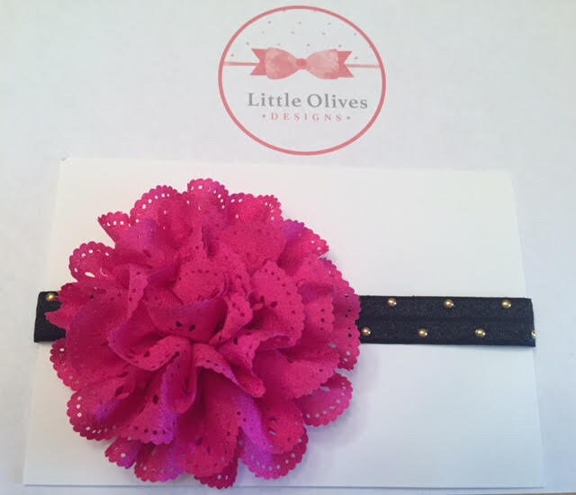 fushia eyelet flower with black band with gold dots