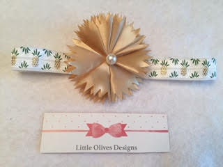 gold flower with pearl center and gold pineapple accent white headband