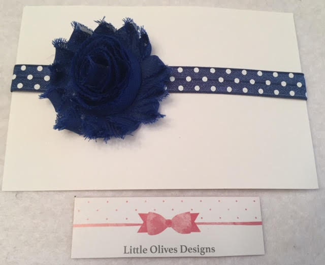 blue flower with blue and white polka dots headband