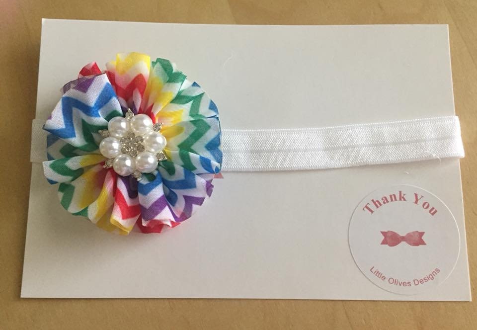 rainbow flower with pearl center and white headband