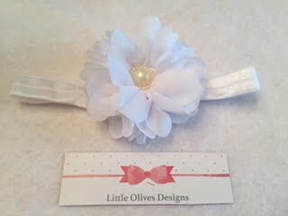 white flower with pearl center and white headband