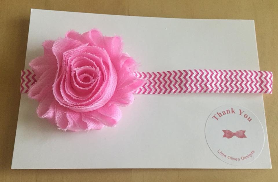 pink flower with pink and white chevron headband