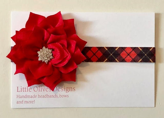 Red poinsettia with red and black plaid headband