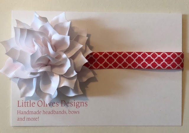 white poinsettia with red quatrefoil headband