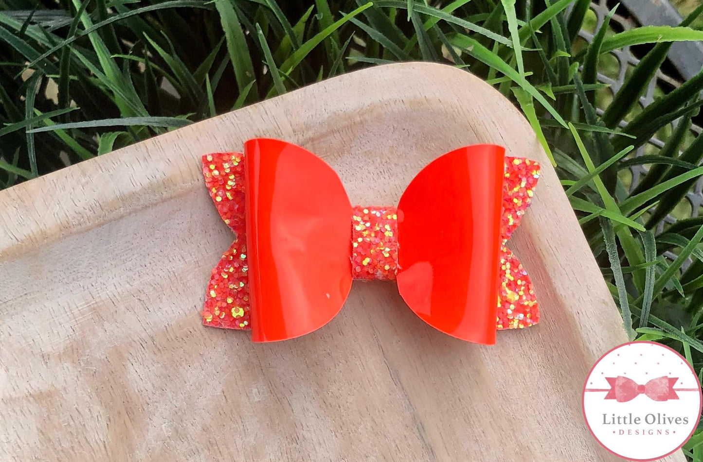 ORANGE PATENT BOW